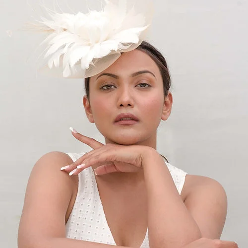 Affordable felt hat for budget-friendly accessorizing -Beige fascinator with white feather flower