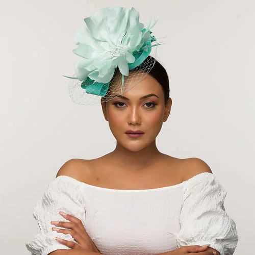 Soft felt hat for cozy everyday comfort -Pale tea green fascinator base with icy blue statement flower